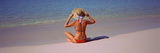 Rear View of a Woman Sitting on the Beach  Bahamas