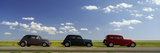 Three Hot Rods Moving on a Highway  Route 66  USA