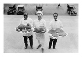 Three Chefs Stand on Steps and Hold Up Thanksgiving Platters of Pies  Apples and Turkey