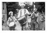Three Boys March with Instruments on the 4th of July Celebration