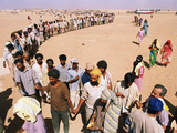 Kuwait Refugees Wait for Bread 1990