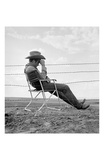 James Dean Seated Behind Fence