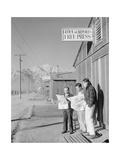 Roy Takeno (Editor) and Group Reading Manzanar Paper [IE Los Angeles Times] in Front of Office