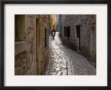 Scooter Riding Down Cobbled Backstreet