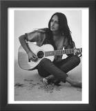 Folk Singer Joan Baez Strumming Her Guitar on the Beach Near Her Home