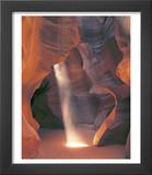 Sunbeam Illuminates Sandy Floor and Sandstone Walls of a Slot Canyon  Antelope Canyon  Page