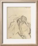 Danseuse assise  essayant ses pointes