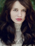 A Girl with Long Dark Hair Wearing a Lace Dress