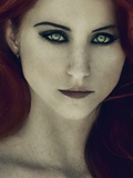 A Girl with Red Hair and Piercing Eyes