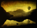 A Hot Air Balloon in Flight over Lakes and Mountains