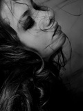 A Girl with Hair Blowing in the Wind