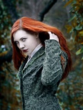 A Girl with Red Hair in the Forest