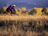 Couple Mountain Biking in Fall