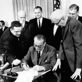 President Lyndon Johnson Signs the 24th Amendment to the Constitution