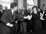 Eunice Shriver Receives a Signing Pen from Her Brother  President John Kennedy