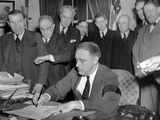 Pres Franklin Roosevelt Signs Joint Congressional Resolution Declaring War  4:10pm  Dec 8  1941