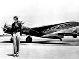 Amelia Earhart Standing in Front of the Lockheed Electra in Which She Disappeared in July 29  1937