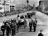 President Kennedy’S Flag-Draped Coffin Moves Slowly Past Mourning Crowds