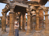 Tourist Photographing Qutb Minar (UNESCO World Heritage Site)  Delhi  India
