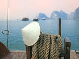 Conical Hat on Junk Boat and Karst Islands in Halong Bay  Vietnam
