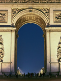 People Standing under the Arc De Triomphe at Night  Paris  France