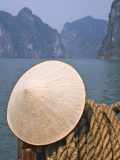 Conical Hat on Junk Boat and Karst Islands in Halong Bay  Vietnam