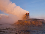 Fly Geyser with Snow Capped Granite Range in the Black Rock Desert Near Gerlach  Nevada  USA