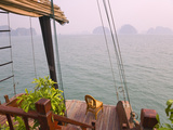 Junk Boat and Karst Islands in Halong Bay  Vietnam