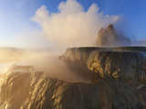 Fly Geyser with Snow Capped Granite Range in the Black Rock Desert Near Gerlach  Nevada  USA
