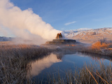 Fly Geyser with Snow Capped Granite Range in the Black Rock Desert Near Gerlach  Nevada  USA