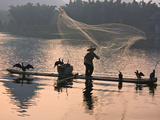 Fisherman Fishing with Cormorants on Bamboo Raft on Li River at Dusk  Yangshuo  Guangxi  China