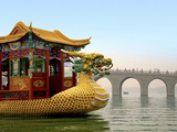 The Summer Palace  Traditional Dragon Boat and Seventeen Arch Bridge  Kunming Lake  Beijing  China