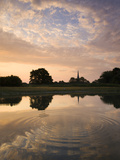 Salisbury Cathedral Spire and Beautiful Dawn Sky Reflected in Rippled Pond  Salisbury  England