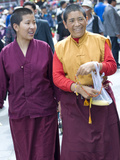 Two Nuns Walking on Barkor Street in Lhasa  Tibet  China  Asia