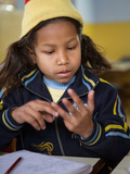 Female Young Rescued Nepali Child Doing Sums in Orphanage  Bhairawa  Nepal