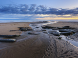 Sunset over Rocks with Flowing Water at Dunraven Bay  Southerndown  Wales