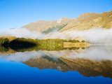 Misty Dawn Reflections on Calm Lake Moke  Queenstown  Otago  South Island  New Zealand  Pacific