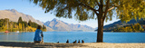 Panorama of Tourist Relaxing by Lake Wakatipu in Autumn at Queenstown  Otago  New Zealand