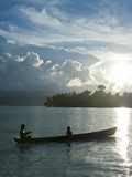 Boys in a Canoe in Backlit in the Marovo Lagoon  Solomon Islands  Pacific