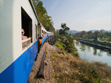 Tourists on a Train Ride on the Death Railway Along the River Kwai  Kanchanaburi  Thailand