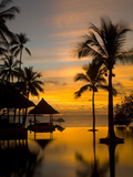 Sunset Scene with Infinity Pool and Trees Overlooking the Java Sea