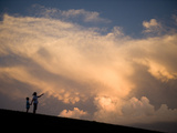 A Mother and Her Young Son Watch as a Thunderstorm Nears