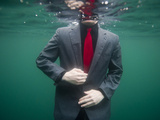 A Teenage Boy Swims in a Suit Along the Coast of Fernandina Island