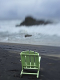 A Green Lounge Chair on a Black Sand Beach