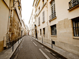 A Small Street Lined with Traditional Parisian Buildings