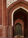 A Man Squats in the Taj Mahal