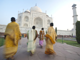 Women in Traditional Dress Approach the Taj Mahal