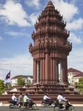 Motorcycles Passing Independence Monument  Phnom Penh  Cambodia