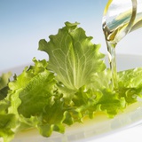 Oil Running onto Lettuce Leaves
