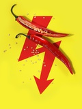 A Sliced-Open Chilli Pepper on a Red Arrow